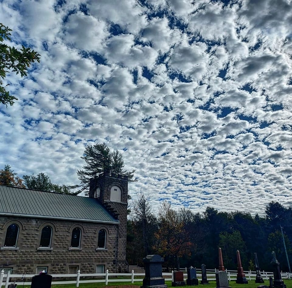 Sand Hill Presbyterian Church beneath a dramatic sky